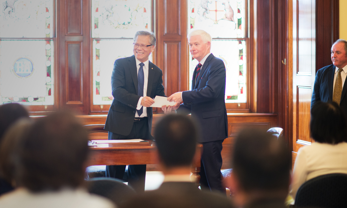 Deputy Premier John Rau (left) being sworn in by Governor Hieu Van Le to his new portfolios today.