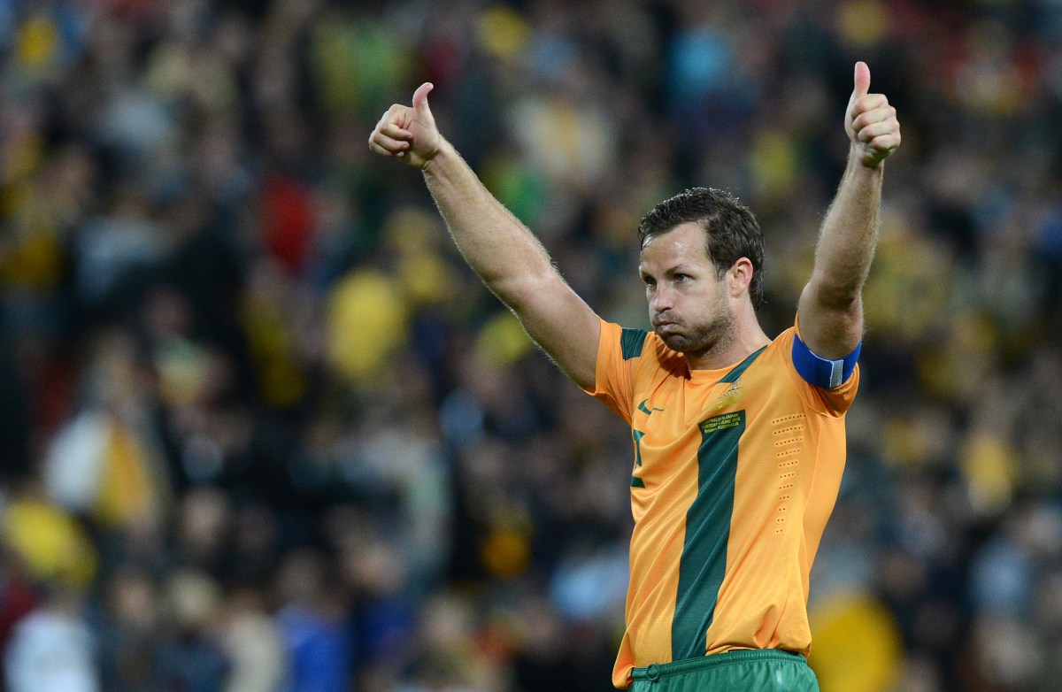 Socceroos captain Lucas Neill reacts with the crowd following the 1-1 draw between Australia and Japan in the 2014 FIFA World Cup Asian Qualifier match at Suncorp Stadium in Brisbane, Tuesday, June 12, 2012. (AAP Image/Dave Hunt) NO ARCHIVING