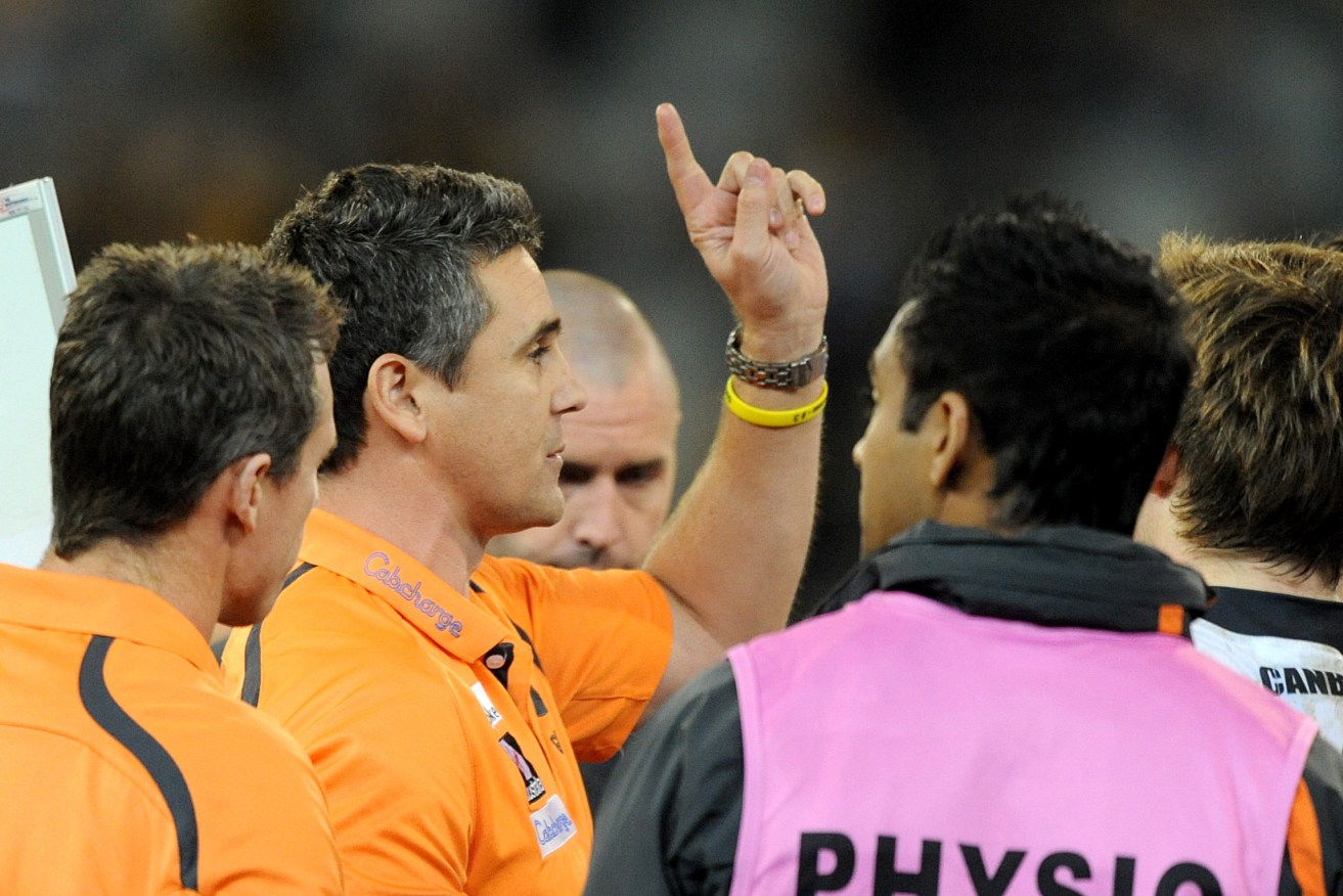 THE ONLY WAY IS UP? GWS coach Leon Cameron addresses his charges. Photo: Joe Castro, AAP.