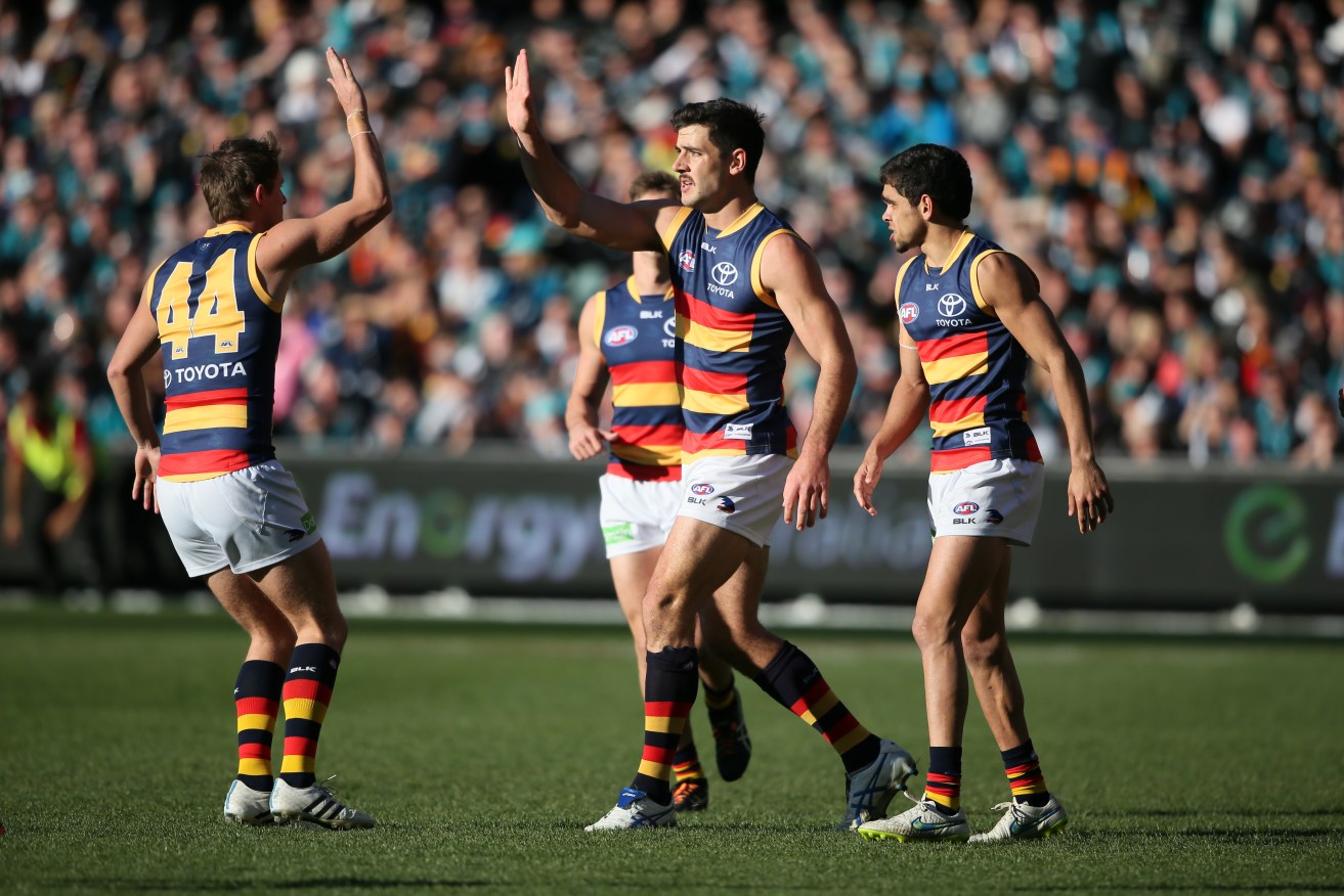 Taylor Walker and Matt Crouch celebrate a goal during last year's emotional Round 16 Showdown. Photo: Ben Macmahon, AAP.