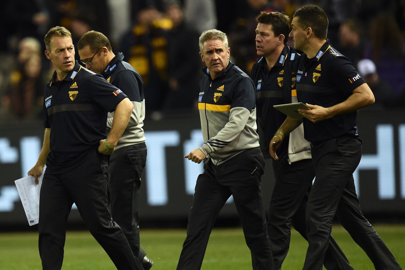 Alastair Clarkson with his coaching assistants during a match against Carlton last year. Photo: Julian Smith, AAP.