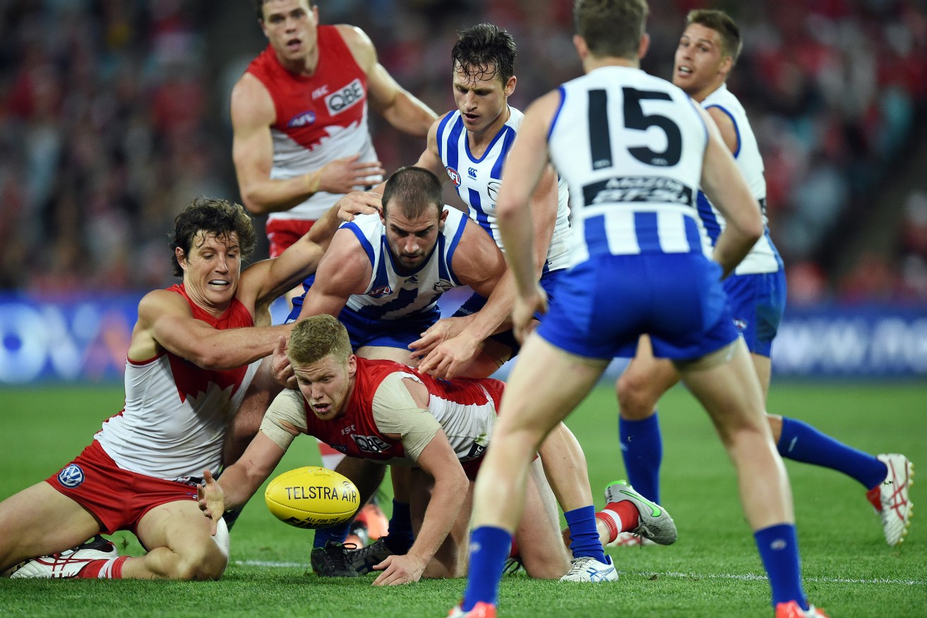 Dan Hannebery competes for the ball in the Swans' losing semi-final to the Kangaroos last year. Photo: Dean Lewins, AAP.
