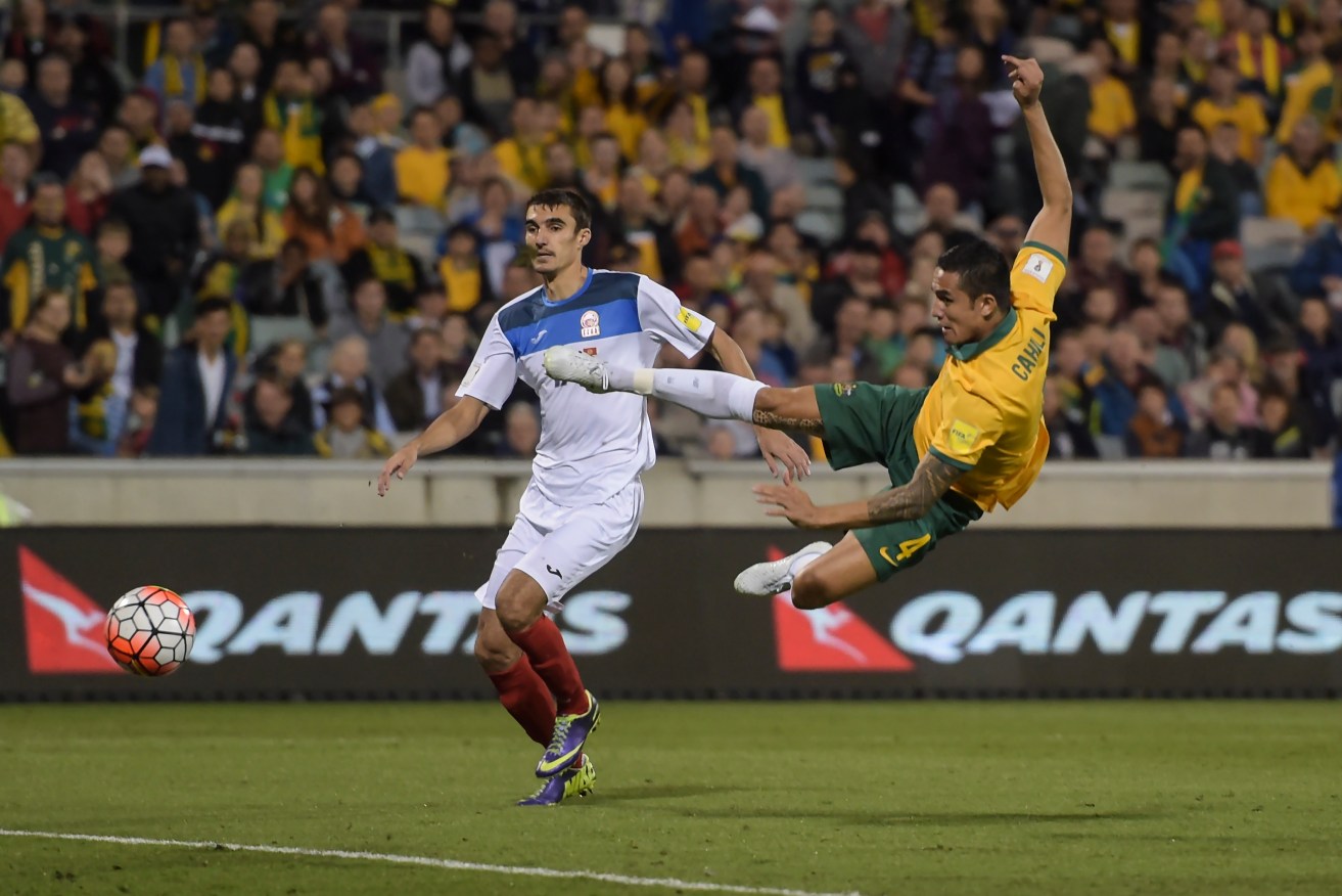 Tim Cahill takes on Kyrgyzstan during last November's World Cup qualifier. Photo: Lukas Coch, AAP.