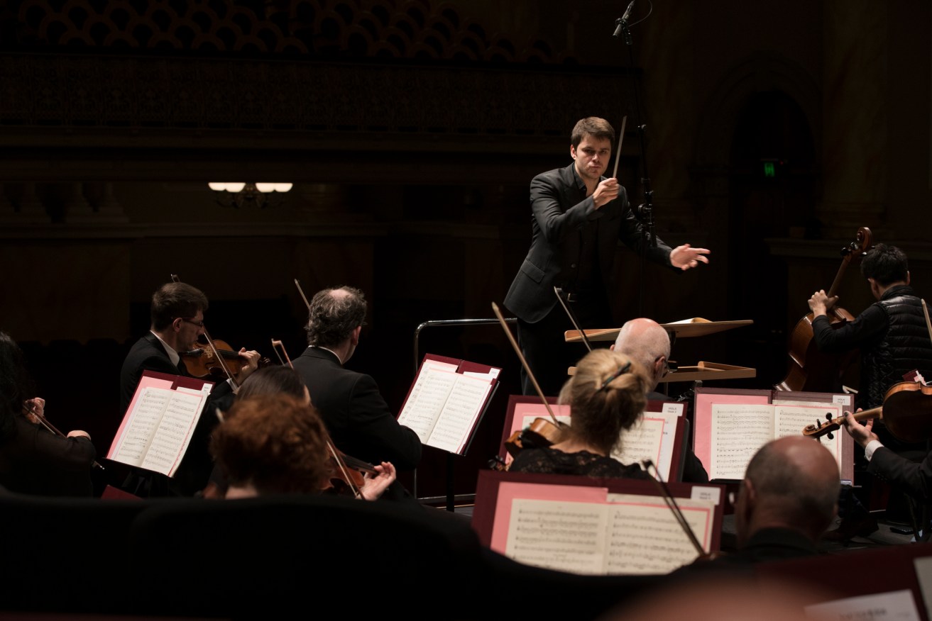 Nicholas Carter conducting the ASO. Photo: Shane Reid