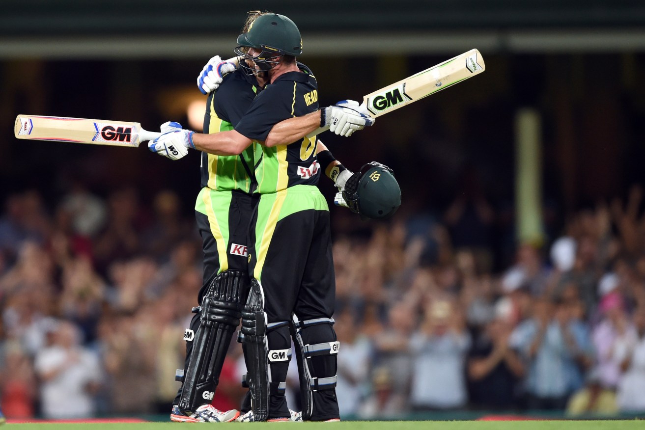 Shane Watson is congratulated by the Travis Head after scoring a remarkable century during last night's loss to India. Photo: Paul Miller, AAP.