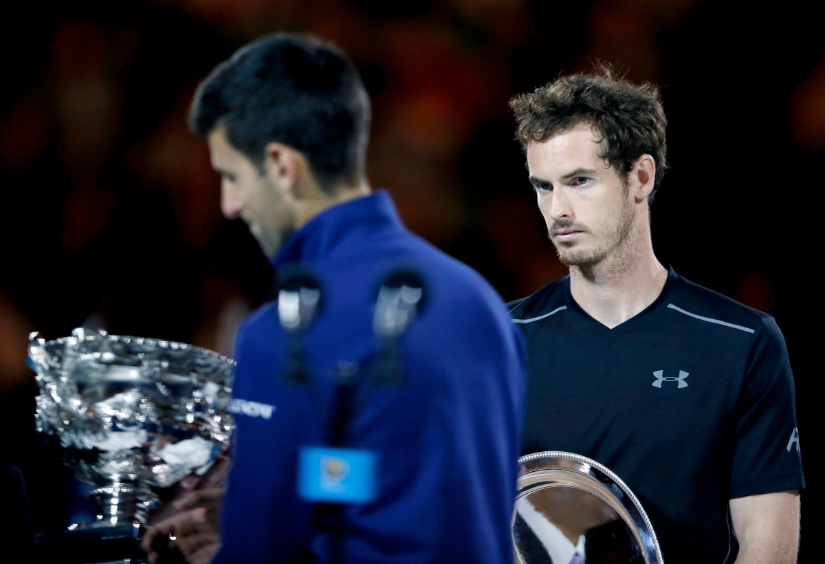 epa05136897 Winner Novak Djokovic of Serbia (L) and defeated Andy Murray of Britain (R) hold their respective trophies after the Men's Final at the Australian Open tennis tournament in Melbourne, Australia, 31 January 2016 EPA/MADE NAGI