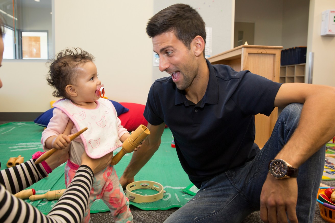 Novak Djokovic in Melbourne yesterday at Mission's Braybrook Early Learning Centre, to which he donated $20,000. Photo: Fiona Hamilton, AAP.
