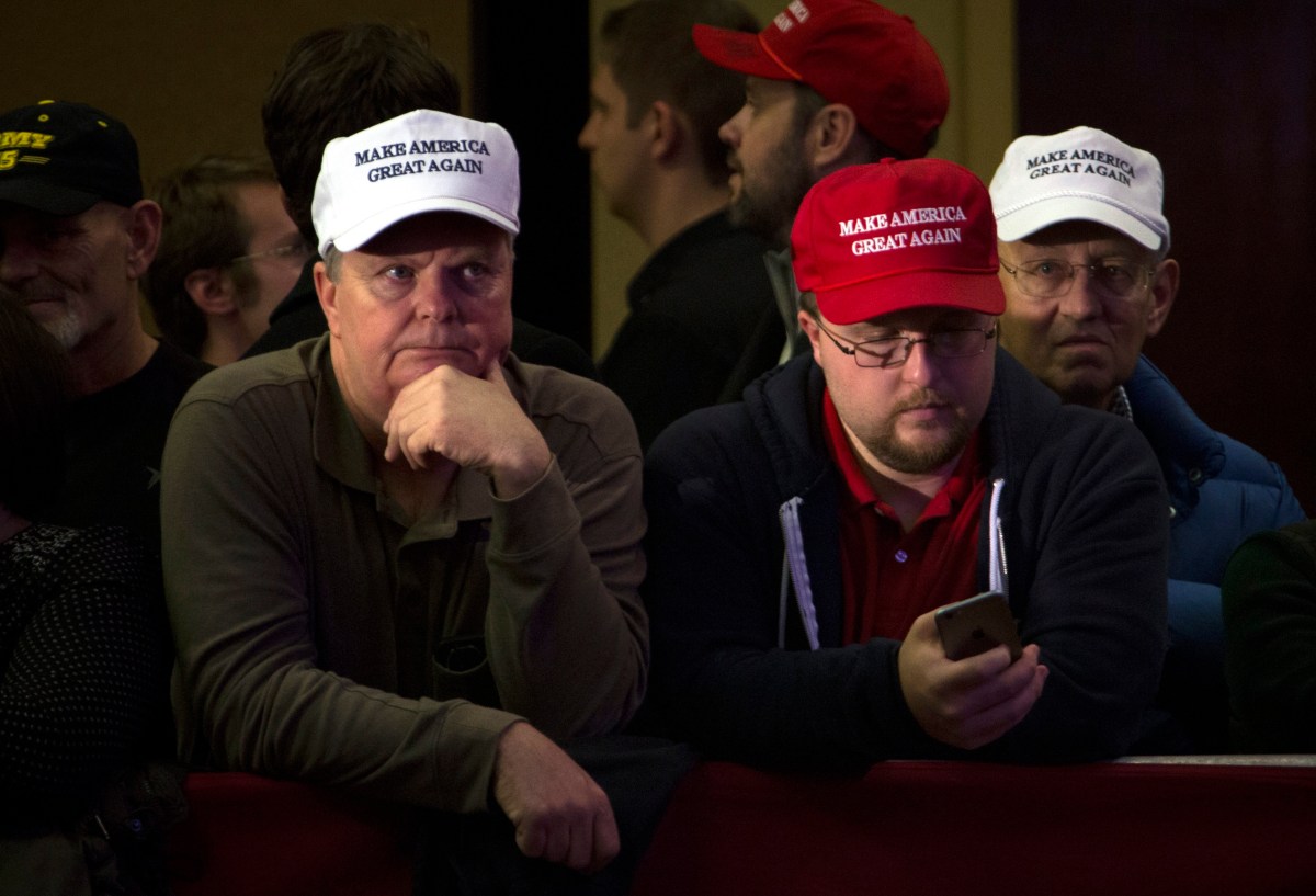 Disappointed Donald Trump's supporters watch the results come in. Photo:  EPA/JOHN TAGGART