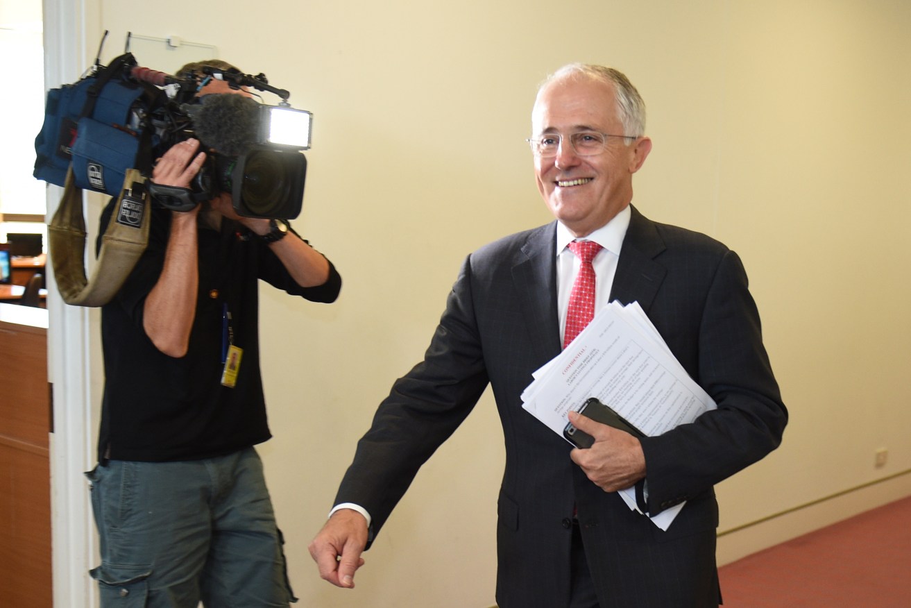 Prime Minister Malcolm says is reportedly considering a plan to allow state incomes taxes. Photo: AAP/Mick Tsikas