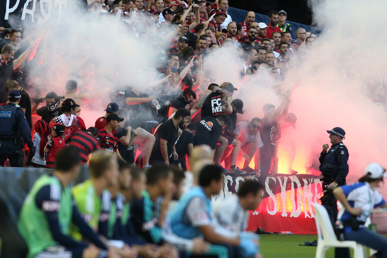 Wanderer fans let off flares during the match against Melbourne Victory. Photo: David Crosling, AAP.