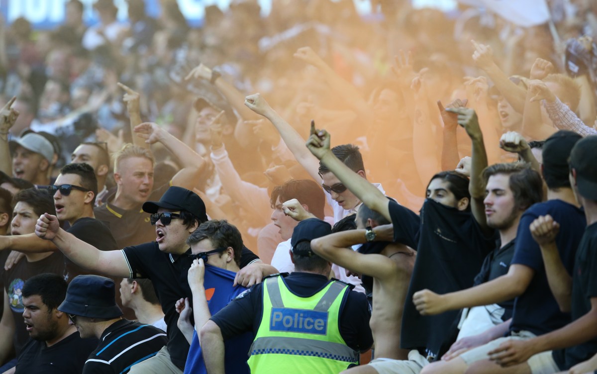 Victory fans let off flares during the round 18 A-League match between Melbourne Victory and Western Sydney Wanderers at Etihad Stadium in Melbourne, on Saturday, Feb. 6, 2016. (AAP Image/David Crosling) NO ARCHIVING, EDITORIAL USE ONLY