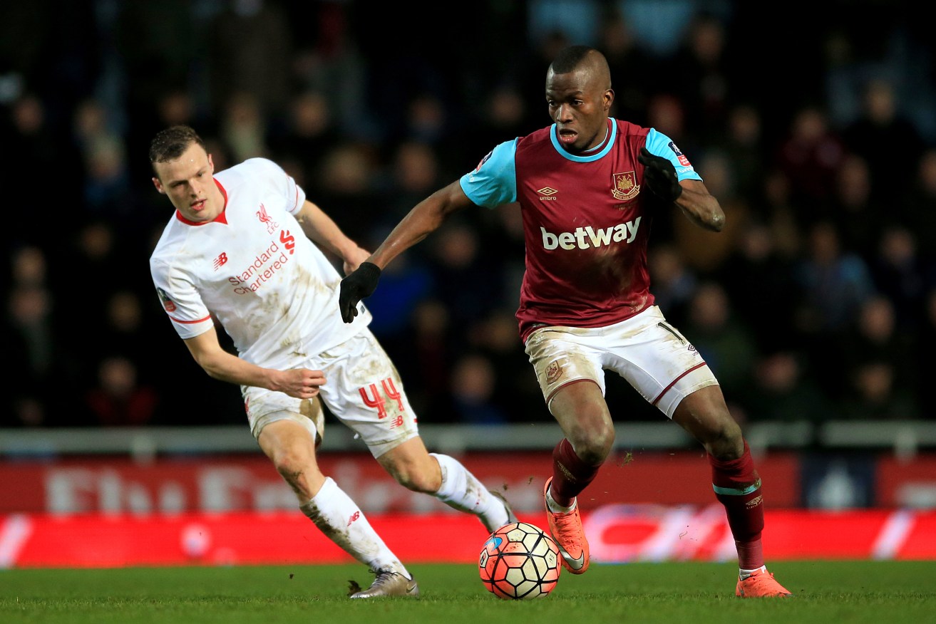 West Ham United's Enner Valencia (right) and Liverpool's Brad Smith in action during the Emirates FA Cup fourth round replay match at Upton Park, London.