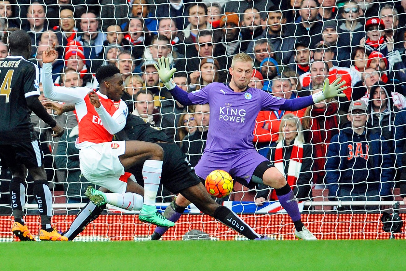 Arsenal's Danny Welbeck in action against Leicester's goalkeeper Kasper Schmeichel. Photo: GERRY PENNY, EPA. 