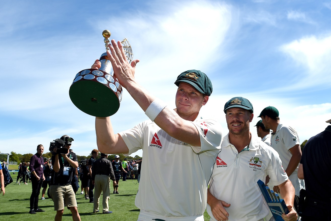 Australian captain Steve Smith with the Trans-Tasman Trophy after Australia won the second Test against New Zealand today. Photo: Dave Hunt, AAP.