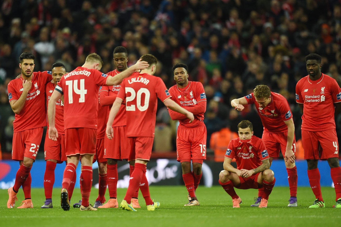 Dejected Liverpool players following their penalty shoot-out loss to Manchester City. Photo: EPA/Andy Rain