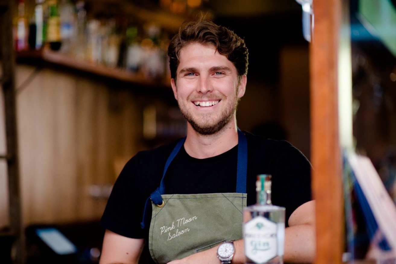 Boutique gin distiller Ty Swan behind the bar at Pink Moon Saloon.