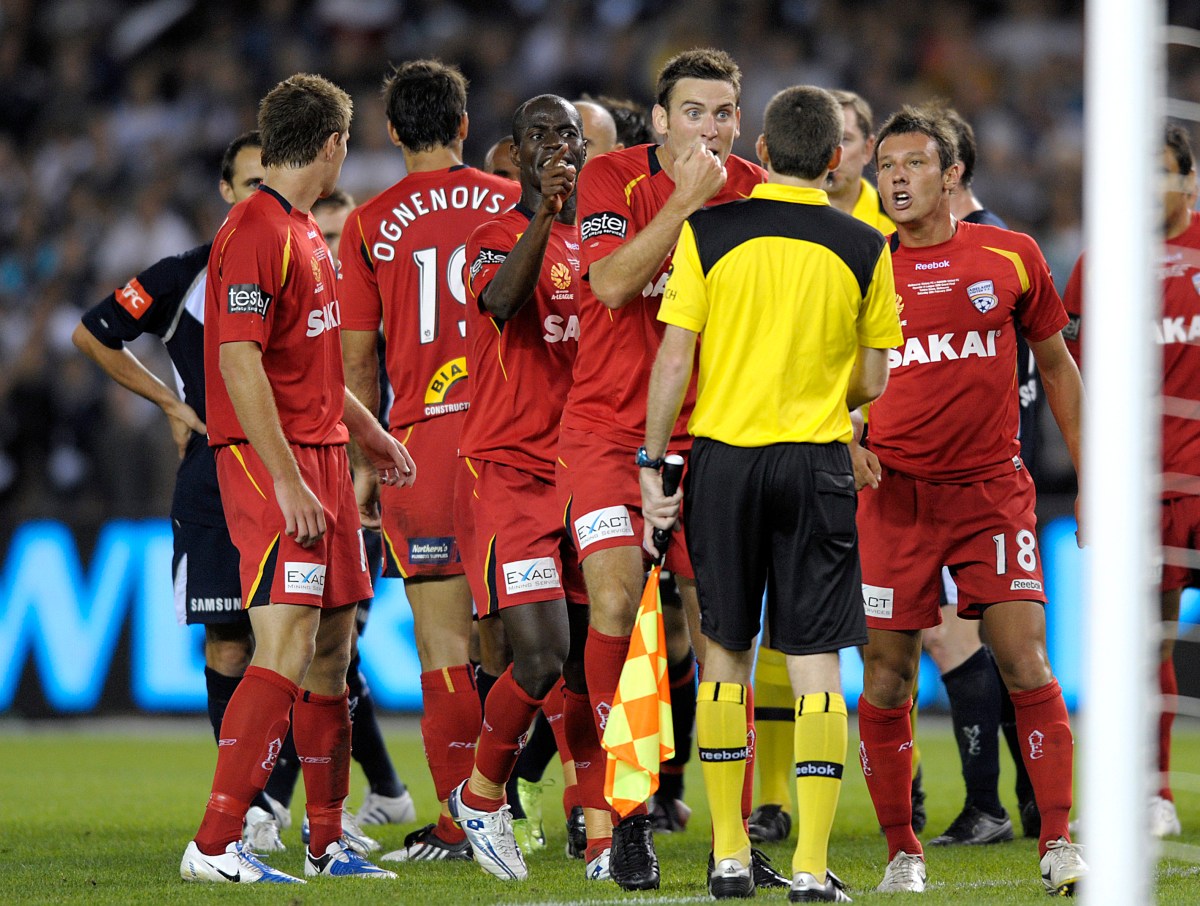 Adelaide United players remonstrate with the Referee at the Grand Final of the A League Soccer at the Telstradome in Melbourne, Saturday, Feb. 28, 2009. Melbourne Victory won the game 1-0. (AAP Image/Martin Philbey) NO ARCHIVING. EDITORIAL USE ONLY.