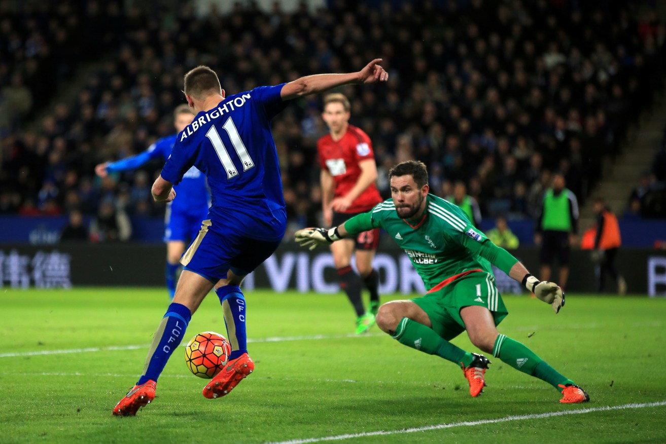 Leicester City's Marc Albrighton crosses the ball whilst under pressure from West Bromwich Albion goalkeeper Ben Foster. Photo: Nick Potts, PA Wire. 