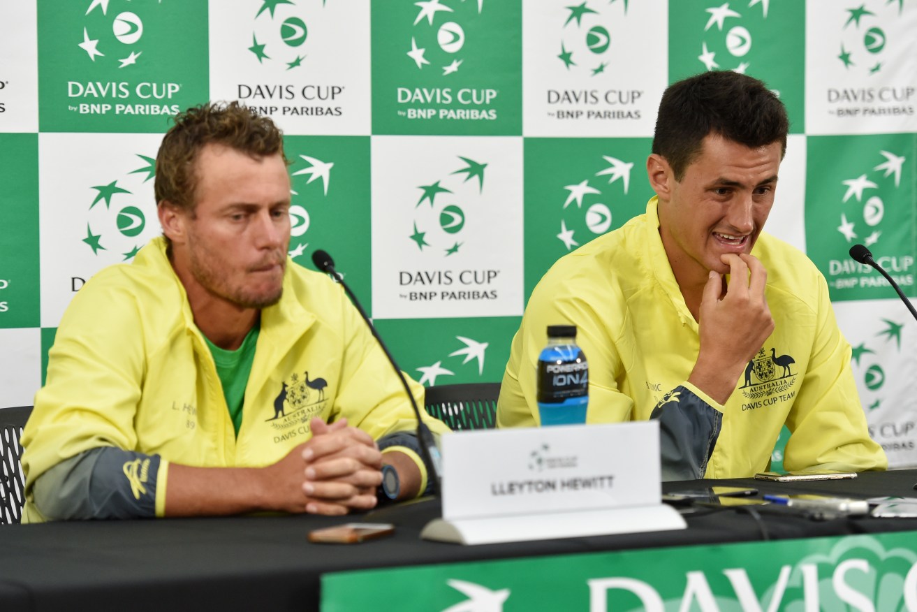 Captain Lleyton Hewitt and Bernard Tomic speak to media about teammate Nick Kyrgios after losing to John Isner of the United States. Photo: Tracey Nearmy, AAP.