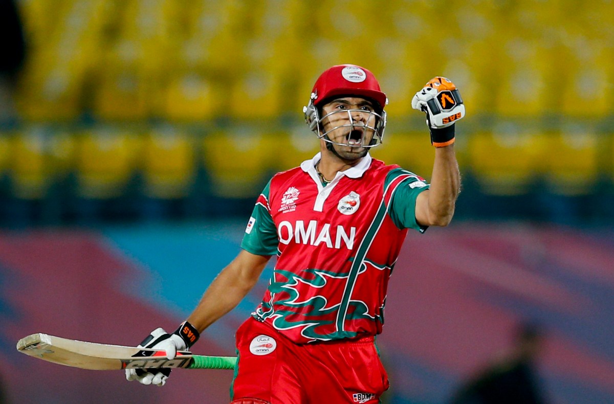Oman's Ajay Lalcheta celebrates after they won the ICC World Twenty20 2016 cricket tournament against Ireland at the Himachal Pradesh Cricket Association (HPCA) stadium in Dharmsala, India, Wednesday, March 9, 2016. Oman won by two wickets. (AP Photo /Tsering Topgyal)