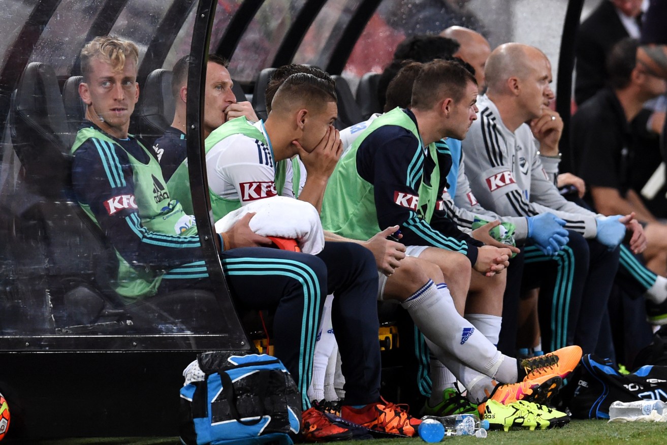 A dejected Melbourne Victory bench watching the carnage unfold against Brisbane Roar. Photo: Dan Peled, AAP.