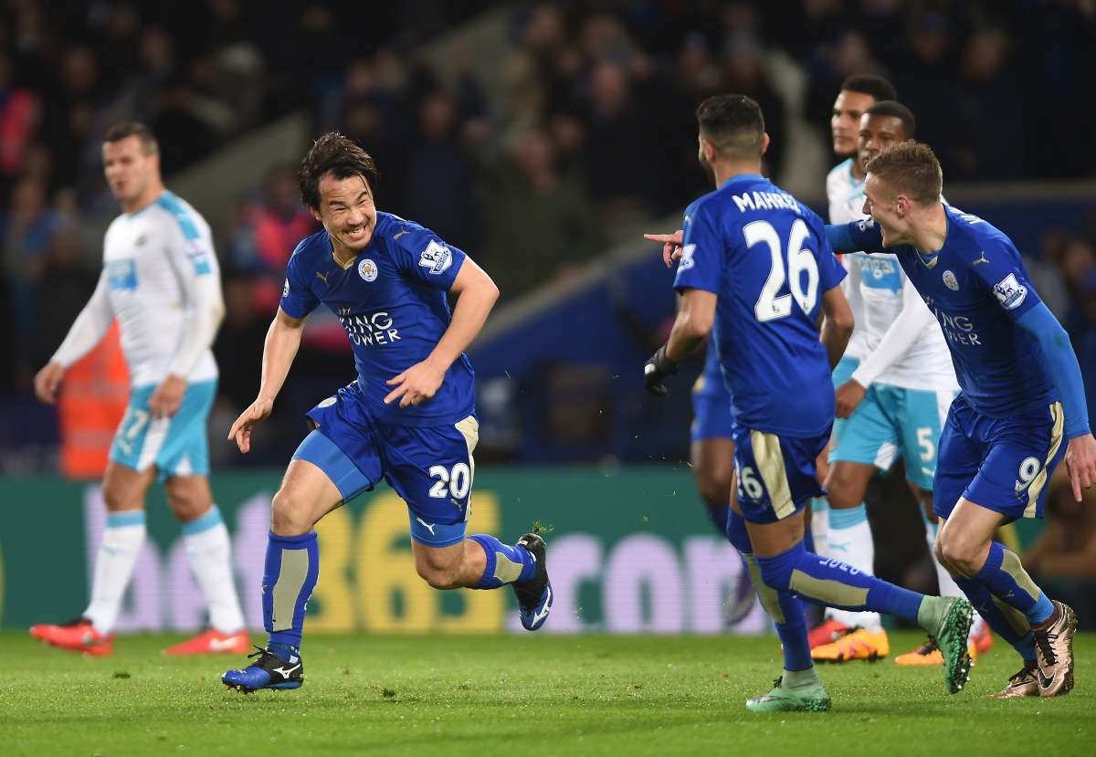 Leicester City's Shinji Okazaki (centre) celebrates scoring his side's first goal of the game.