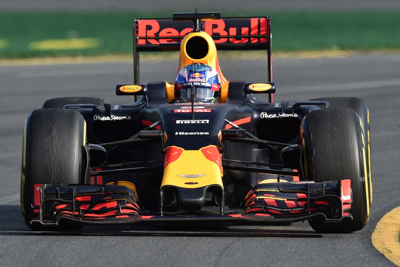 Australian driver Daniel Ricciardo steers his Red Bull racing car out of turn two at the Albert Park street circuit during in the Australian Formula One Grand Prix in Melbourne, Sunday, March 20, 2016. (AAP Image/Julian Smith) NO ARCHIVING, EDITORIAL USE ONLY