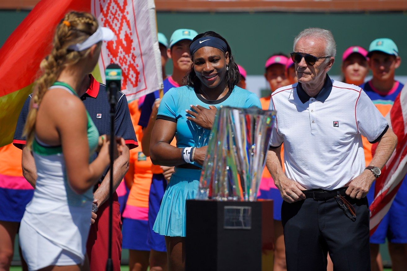 Victorious Victoria Azarenka speaks to Serena Williams, flanked by tournament director Raymond Moore. Photo: Mark J. Terrill, AP.