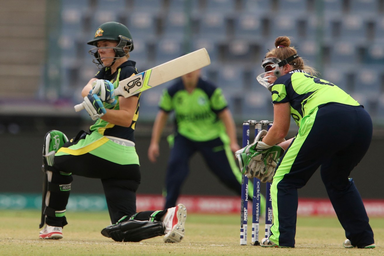 Australia's Elyse Villani hits a boundary in front of Ireland's wicketkeeper Mary Waldron last week. Photo: Manish Swarup, AP.