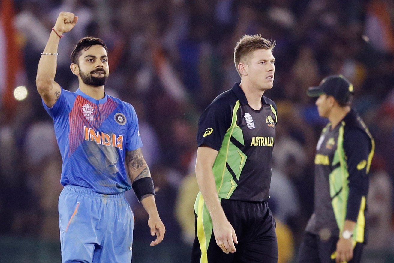 India's Virat Kohli celebrates after smashing  James Faulkner to knock Australia out of the World T20. Photo: Altaf Qadri, AP.