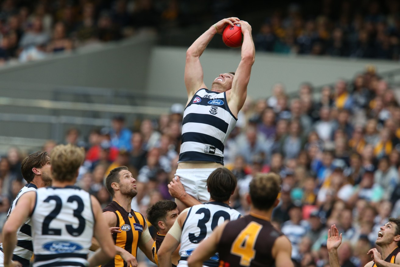 Patrick Dangerfield takes a reasonable mark on his way to an underwhelming three behinds in the final term of Geelong's win against Hawthorn. In a cameo performance, he also had 43 touches. Photo: David Crosling, AAP.