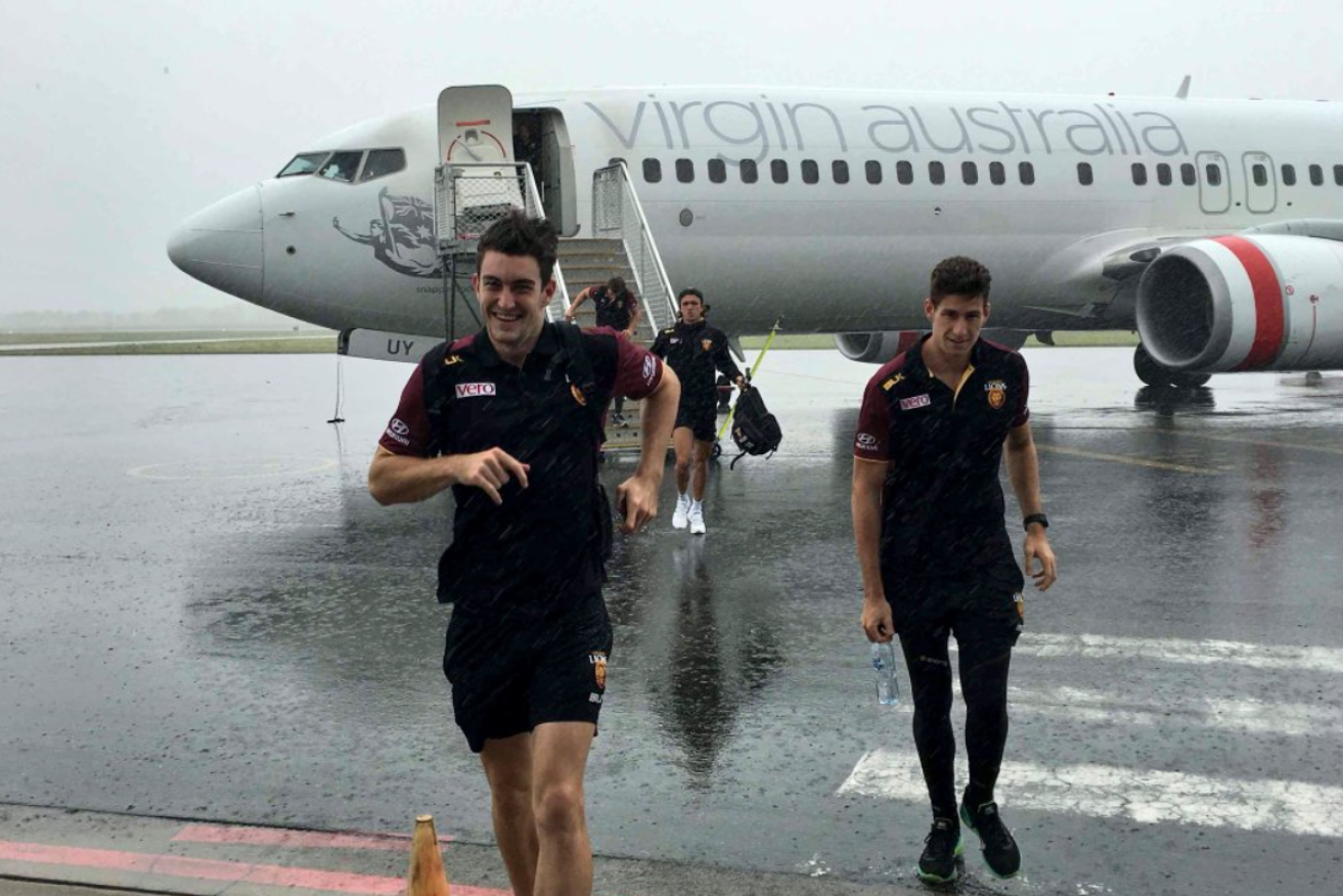 The Brisbane Lions land in a drenched Mackay. Photo: Brisbane Lions.