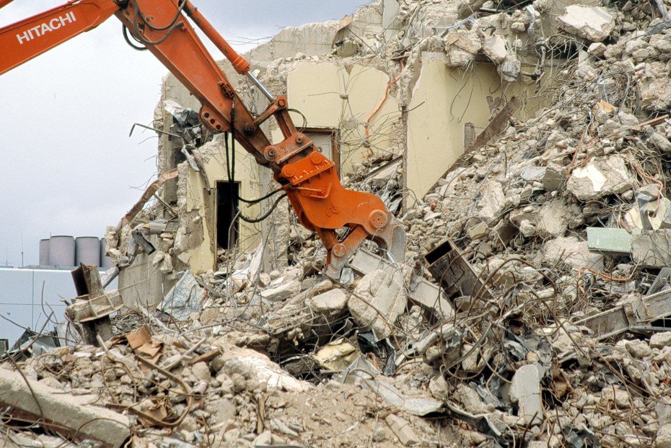 An Adelaide building is demolished in 2002. Sometimes an economy needs "creative destruction". Photo: AAP/Tony Jones