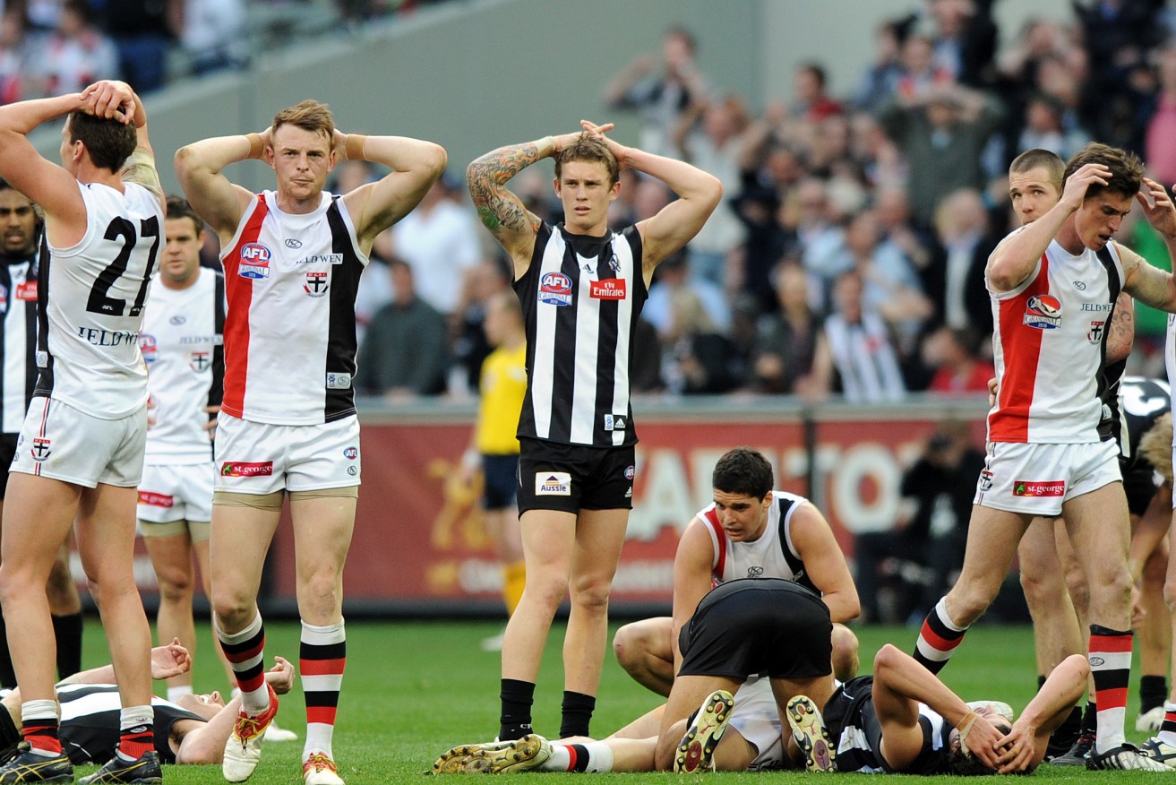 St Kilda and Collingwood players wonder what could have been after the drawn Grand Final in 2010. Photo: Joe Castro, AAP.