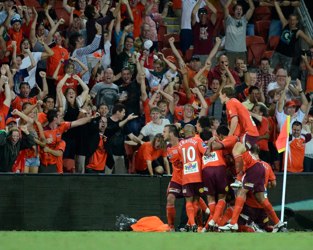 Brisbane Roars team members celebrate after scoring their second goal against the Central Coast Mariners' in their A-League final at Suncorp Stadium in Brisbane, Saturday, March 13, 2011. (AAP Image/Steve Holland) NO ARCHIVING, EDITORIAL USE ONLY