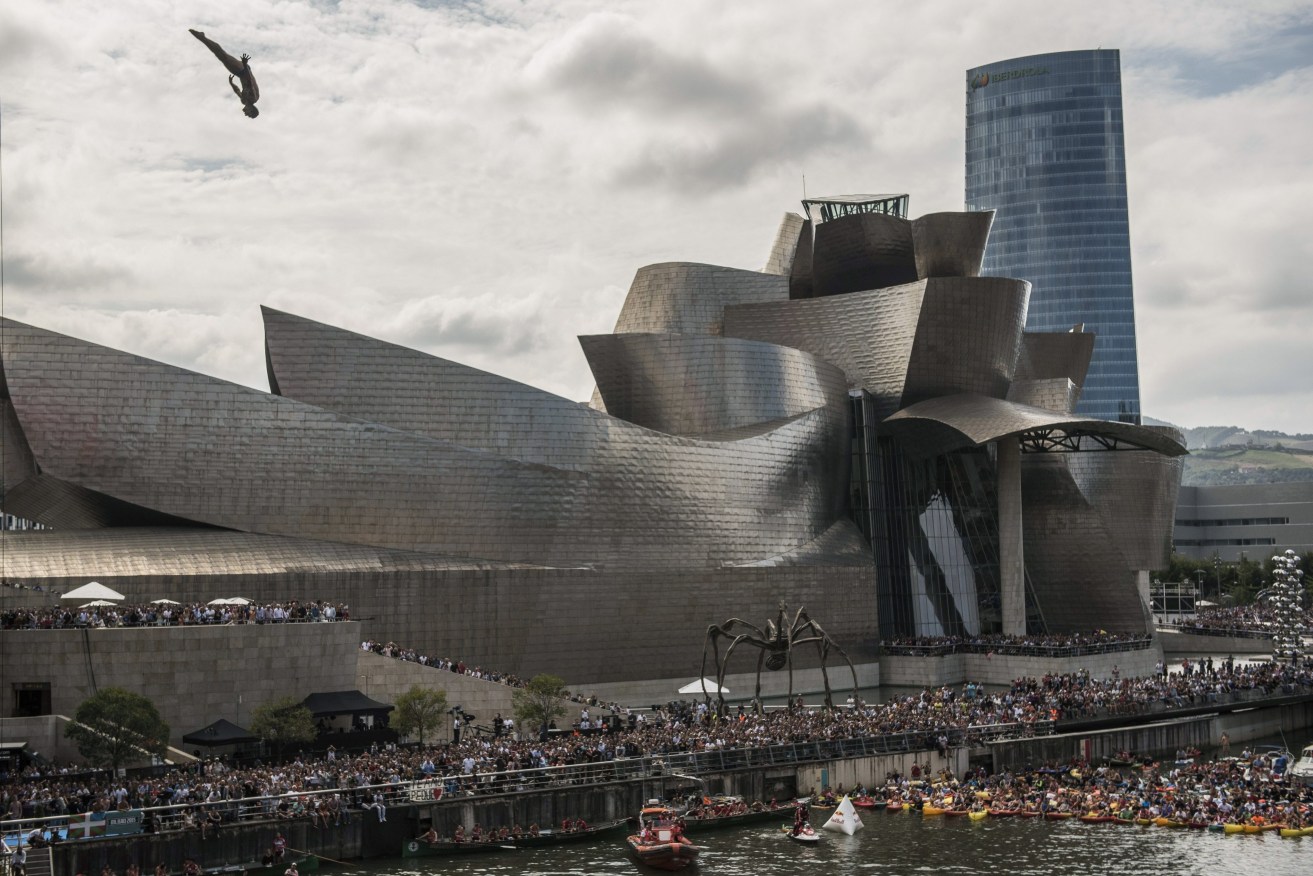 A diving event held at the Nervion river next to de Guggenheim Museum in Bilbao. Photo: EPA/MIGUEL TONA