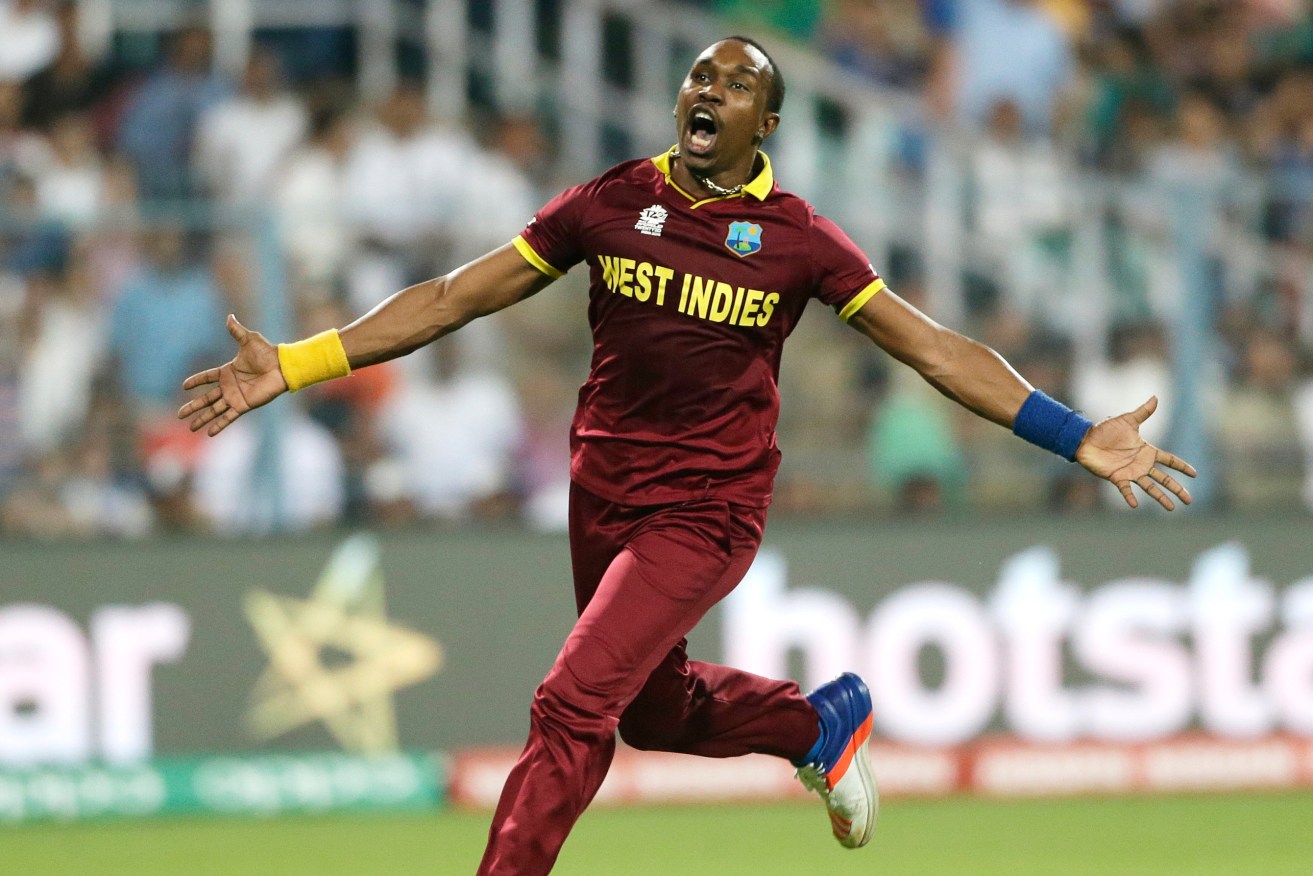 Dwayne Bravo celebrates the wicket of Moeen Ali during the West Indies' WT20 final win over England. Photo: Saurabh Das, AP.