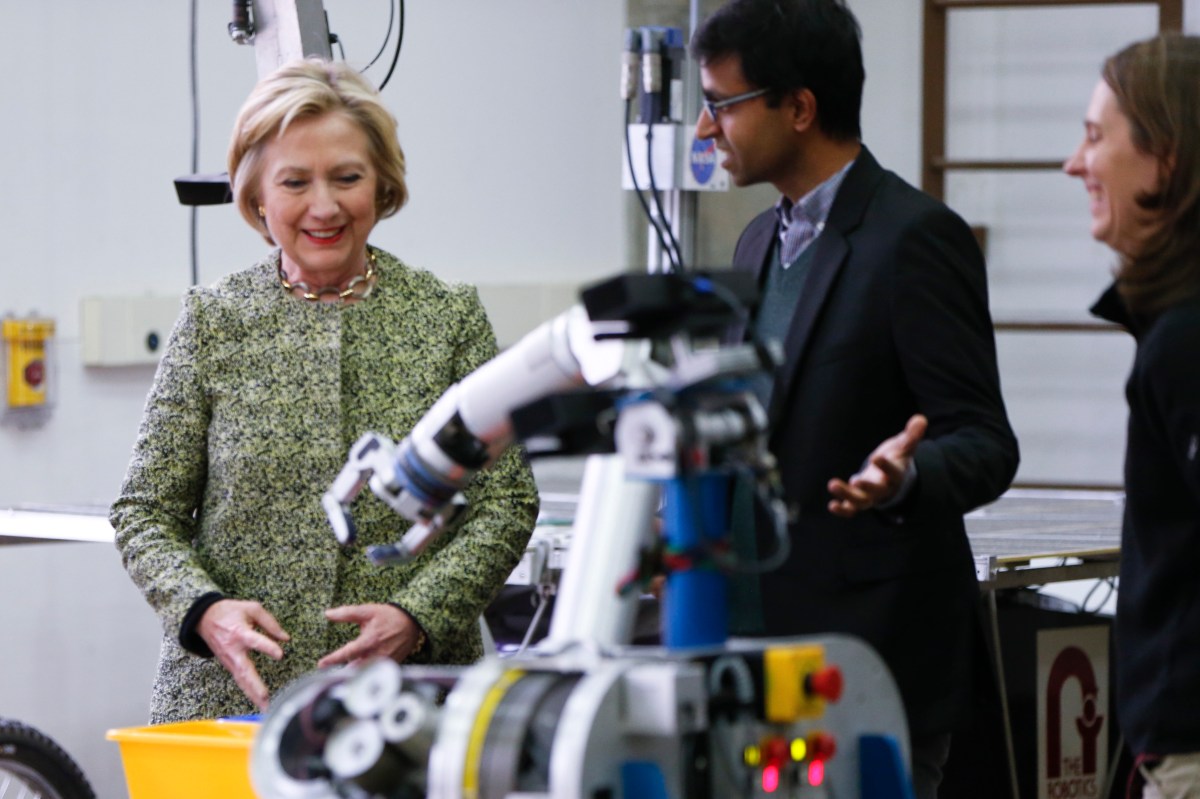 Democratic presidential candidate Hillary Clinton,  with Professor Siddhartha Srinivasa during a tour of a Robotics Lab at Carnegie Mellon University in Pittsburgh. Photo: AP/Keith Srakocic