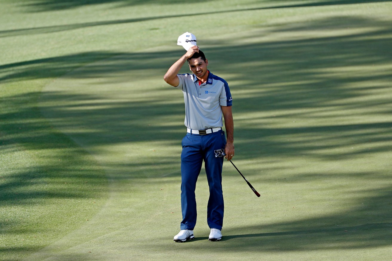 Jason Day reacts to his missed birdie putt on the 15th hole during the first round of the Masters golf tournament. Photo: David J. Phillip, AP.
