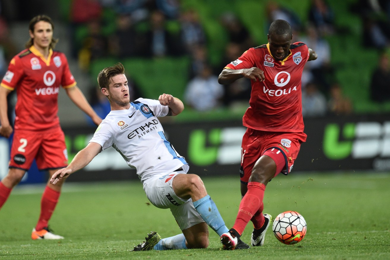 Bruce Djite and Melbourne City's Connor Chapman contest the ball during their previous meeting this month. Photo: Julian Smith, AAP.