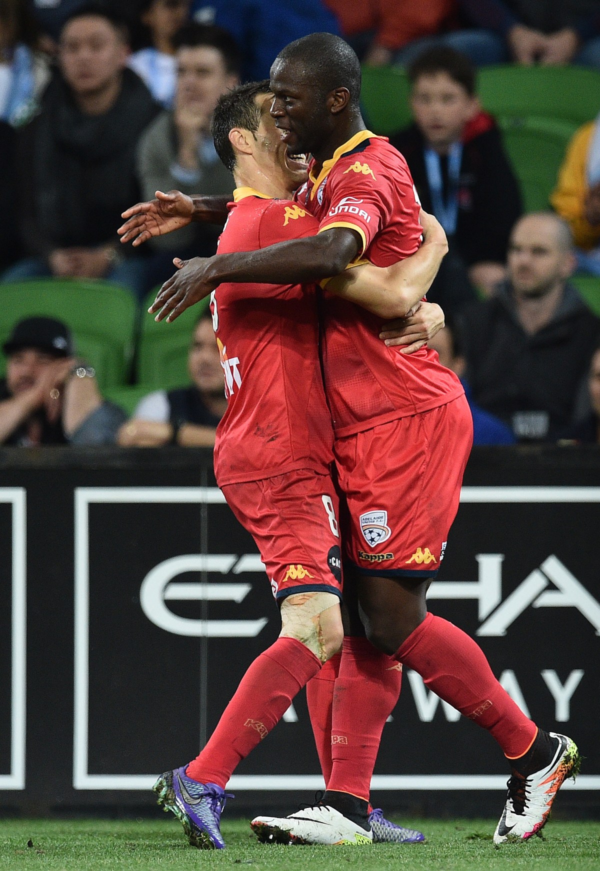 Adelaide United players Isaias (left) and Bruce Djite react after scoring a goal against Melbourne City in round 27 of the A-League at AAMI Park in Melbourne, Friday, April 8, 2016. (AAP Image/Julian Smith) NO ARCHIVING, EDITORIAL USE ONLY