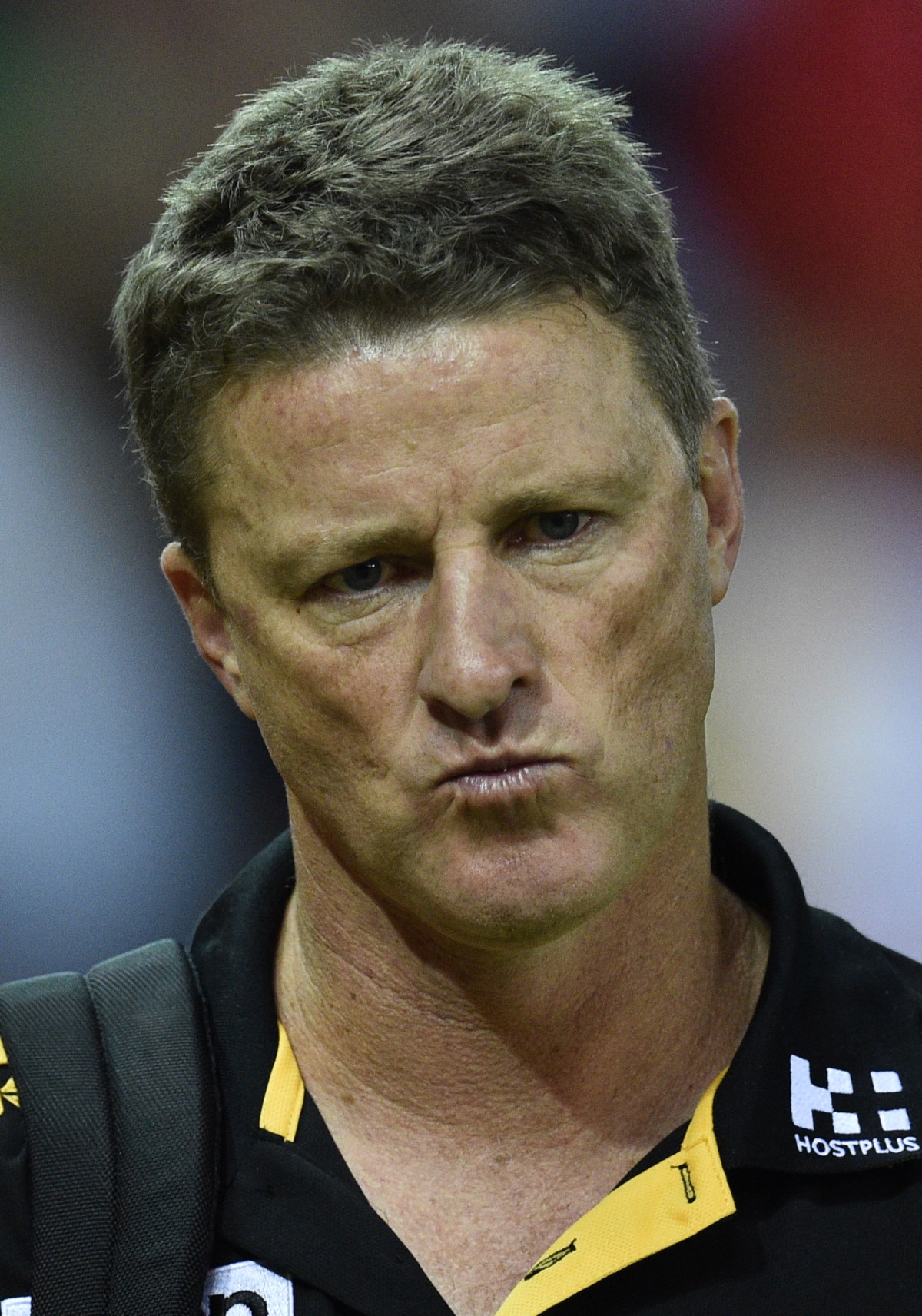 Coach of the Tigers Damien Hardwick makes his way to the change rooms after being defeated by the Adelaide Crows during the round 3 AFL match between the Richmond Tigers and the Adelaide Crows at Etihad Stadium in Melbourne, Saturday, April 9, 2016. (AAP Image/Julian Smith) NO ARCHIVING, EDITORIAL USE ONLY