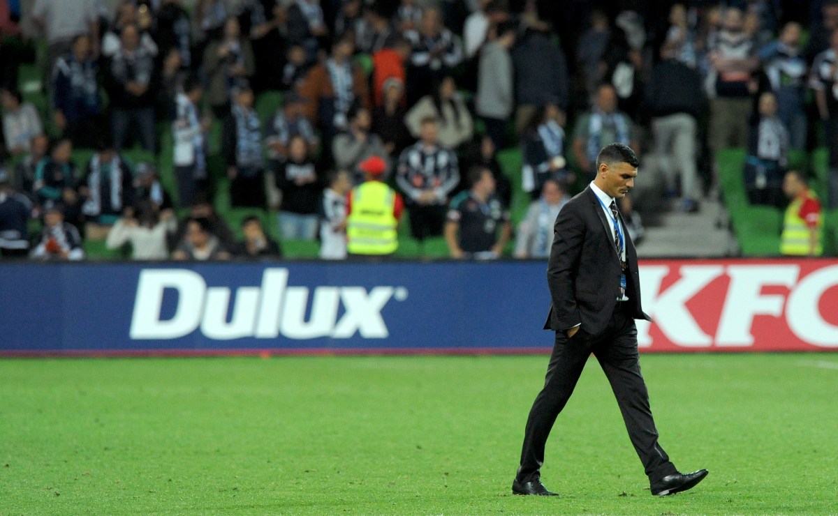 Brisbane coach John Aloisi walks onto the ground following the Round 27 A-League match between the Melbourne Victory and the Brisbane Roar at AAMI Park in Melbourne, Saturday, April 9, 2016. (AAP Image/Joe Castro) NO ARCHIVING, EDITORIAL USE ONLY