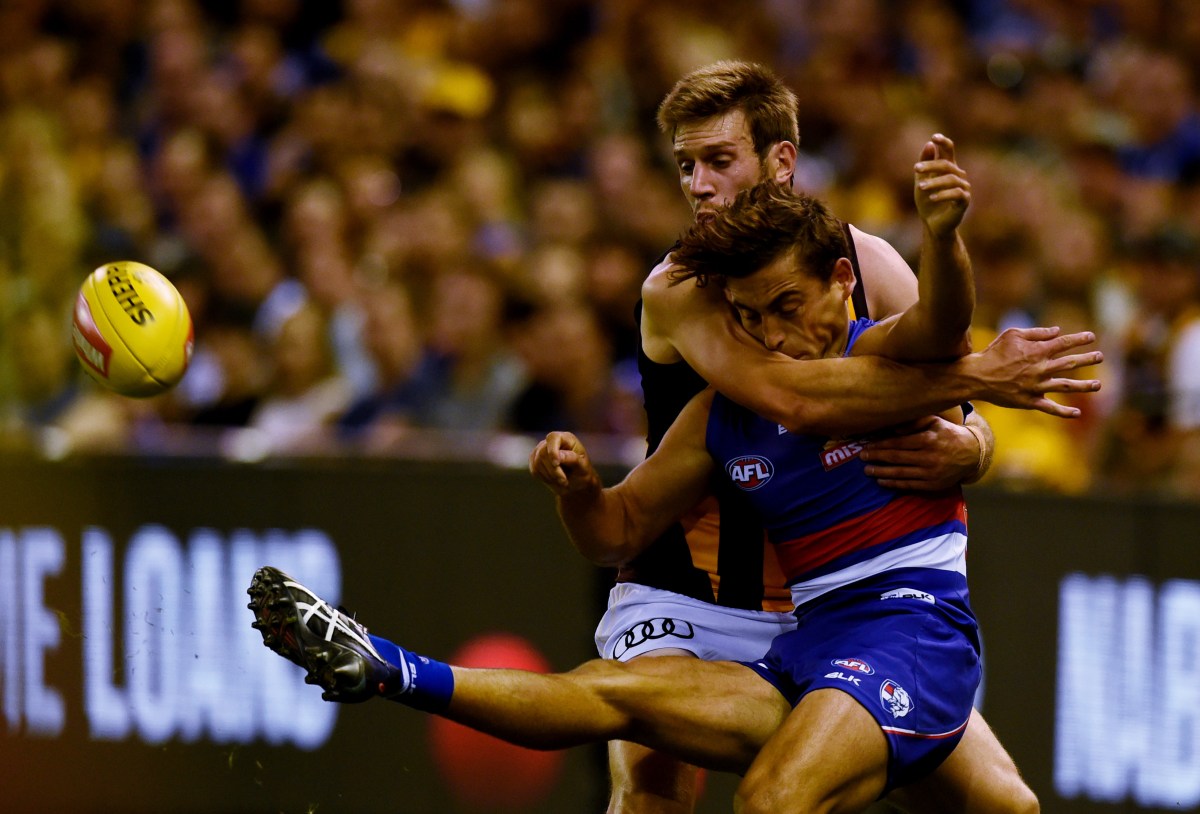 Grant Birchall of the Hawthorn Hawks tackles Matthew Boyd of the Western Bulldogs during their match at Etihad Stadium in Melbourne, Sunday, April 10, 2016. (AAP Image/Tracey Nearmy) NO ARCHIVING, EDITORIAL USE ONLY