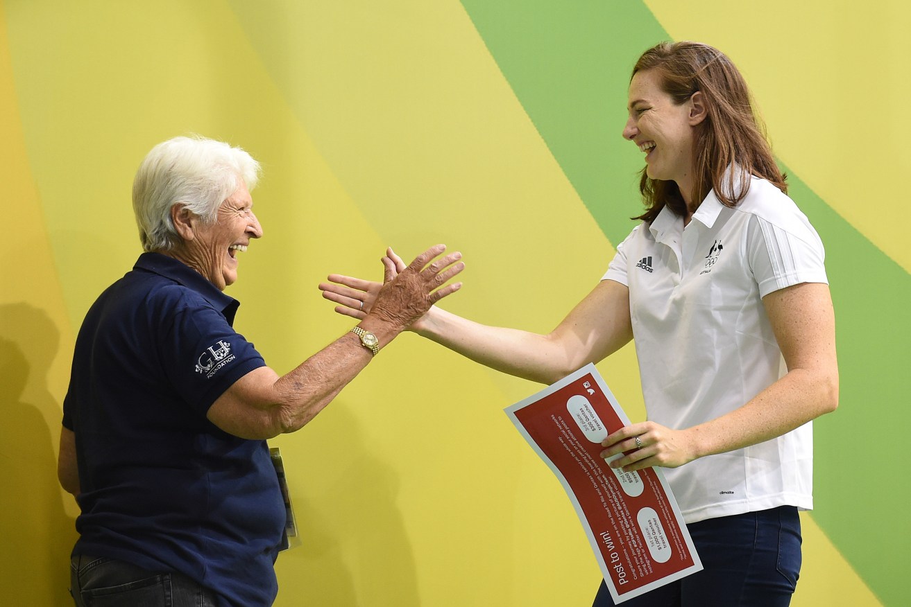 Cate Campbell (right) is congratulated by Australian Olympic legend Dawn Fraser during a Rio Olympic Games 'Boarding Pass' presentation at last week's Australian Swimming Championships in Adelaide. Photo: Dave Hunt, AAP.