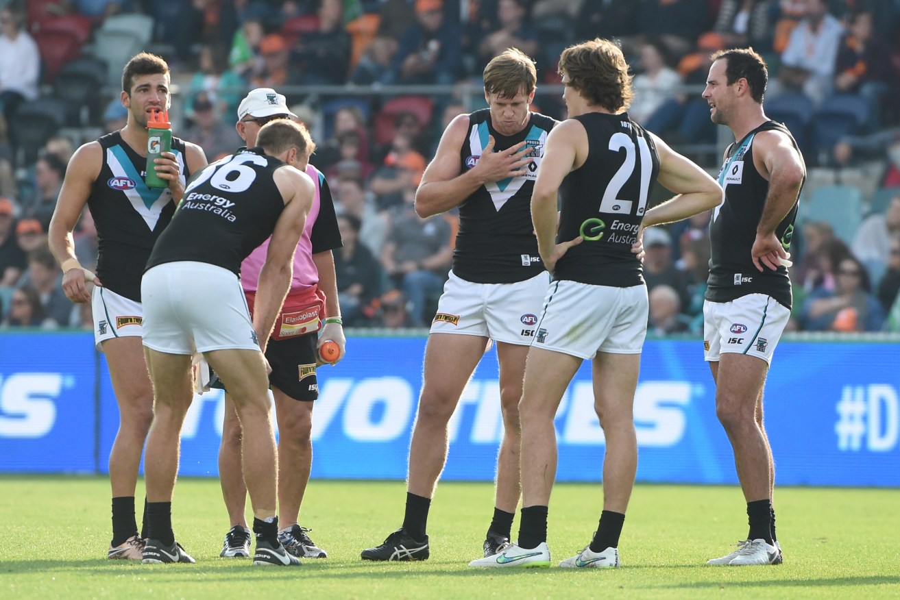 Power players look on after a Giants goal. Photo: Mick Tsikas, AAP.