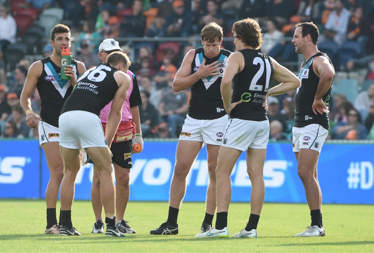 Power players look on after a Giants goal during their Round 4 AFL match between GWS Giants and the Port Adelaide Power at Manuka Oval in Canberra on Sunday, April 17, 2016. (AAP Image/Mick Tsikas) NO ARCHIVING, EDITORIAL USE ONLY