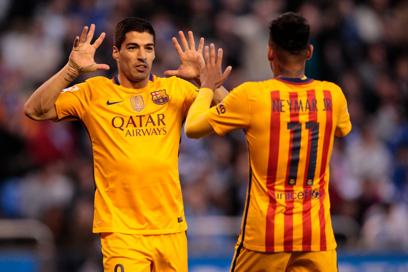 Luis Suarez, left, and Neymar celebrate after one of Barcelona's many goals. Photo: Lalo R. Villar, AP.