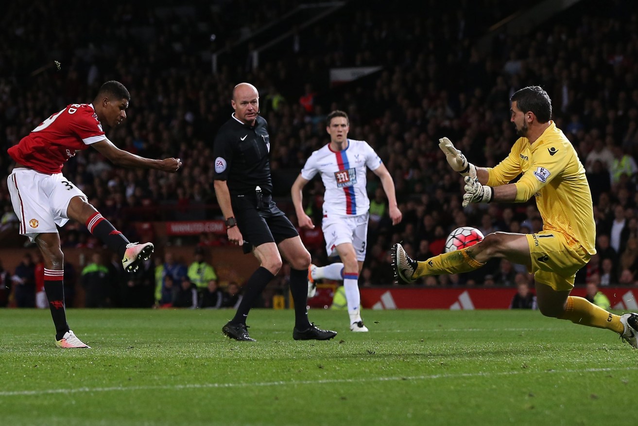 Manchester United's Marcus Rashford has his shot saved by Crystal Palace's Julian Speroni. Photo: Nigel Roddis, EPA.
