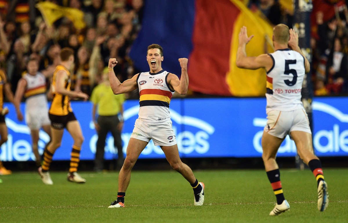 Luke Brown of the Crows reacts after kicking a goal during the round 5 AFL match between the Hawthorn Hawks and Adelaide Crows at the MCG in Melbourne, Friday, April 22, 2016. (AAP Image/Julian Smith) NO ARCHIVING, EDITORIAL USE ONLY